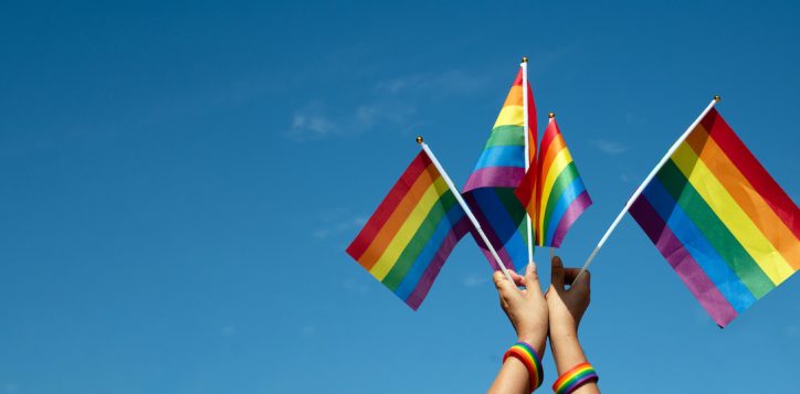 rainbow-flags-showing-in-hands-against-clear-bluesky-copy-space-concept-for-calling-all-people-to-support-and-respcet-the-genger-diversity-human-rights-and-to-celebrate-lgbtq-in-pride-month-2
